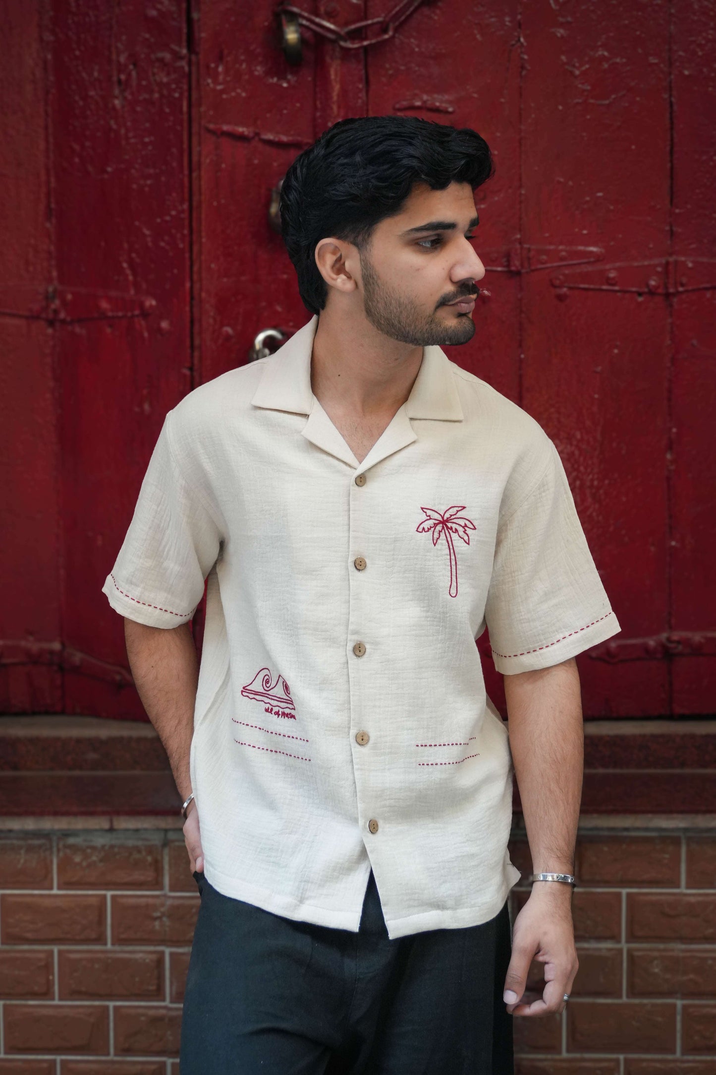 Beige double cloth cotton shirt for men with aari embroidered palm tree and waves, three-quarter view