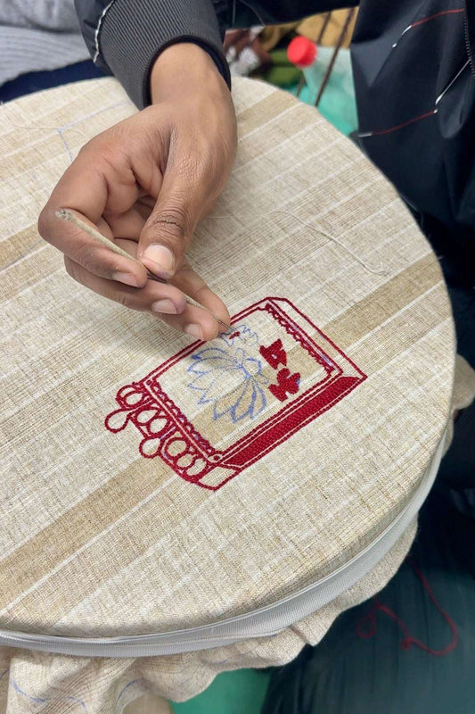 Artisan hand embroidering the matchbox motif, the making of the Sivakasi Embroidered Shirt by Oje'