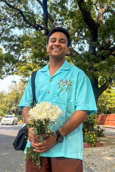 Man wearing aqua blue handloom cotton shirt with hand embroidered floral pocket, front view, Jaipur Embroidered Shirt by Oje'