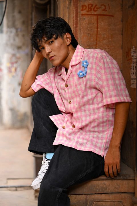 Pink checks cotton shirt for men with blue crochet flowers, seated view