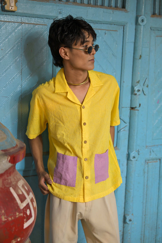 Lemon yellow textured cotton shirt for men with contrast lavender pockets, three-quarter view