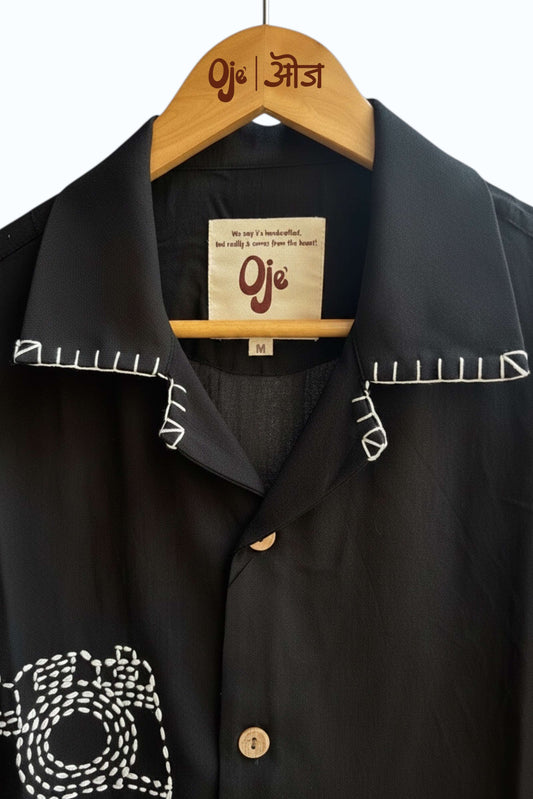 Black Vienna shirt on hanger showing collar embroidery