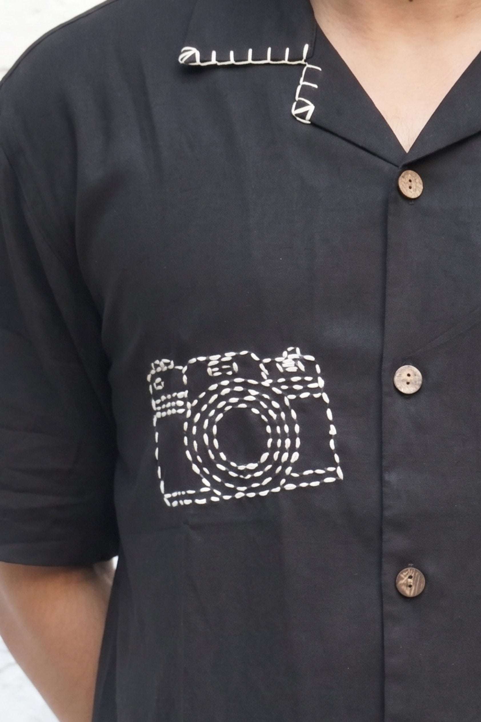 Hand embroidered camera motif and coconut shell buttons, black modal shirt