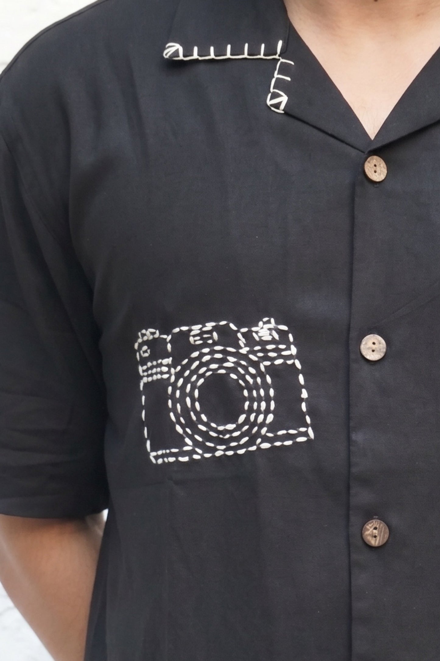 Hand embroidered camera motif and coconut shell buttons, black modal shirt