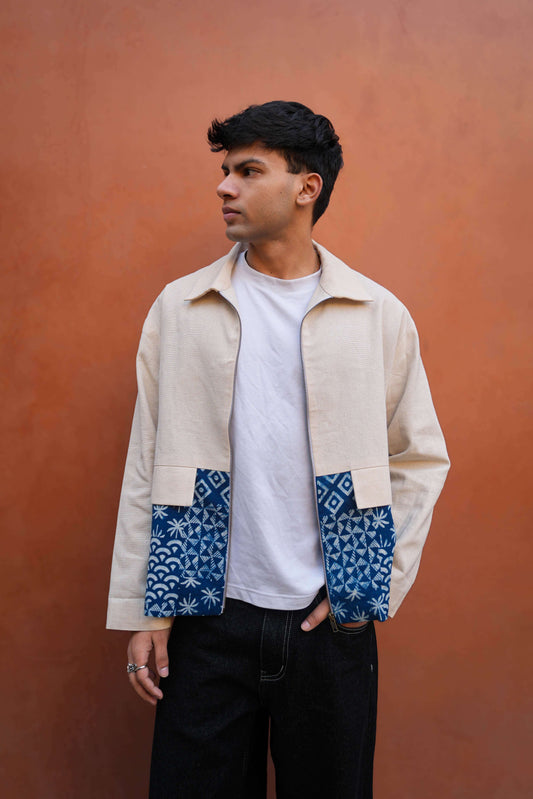 White and indigo cotton jacket for men with hand block print panels, three-quarter view