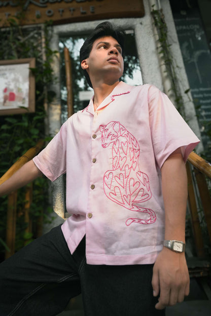 Baby pink cotton shirt for men with hand embroidered pantheress motif, three-quarter view