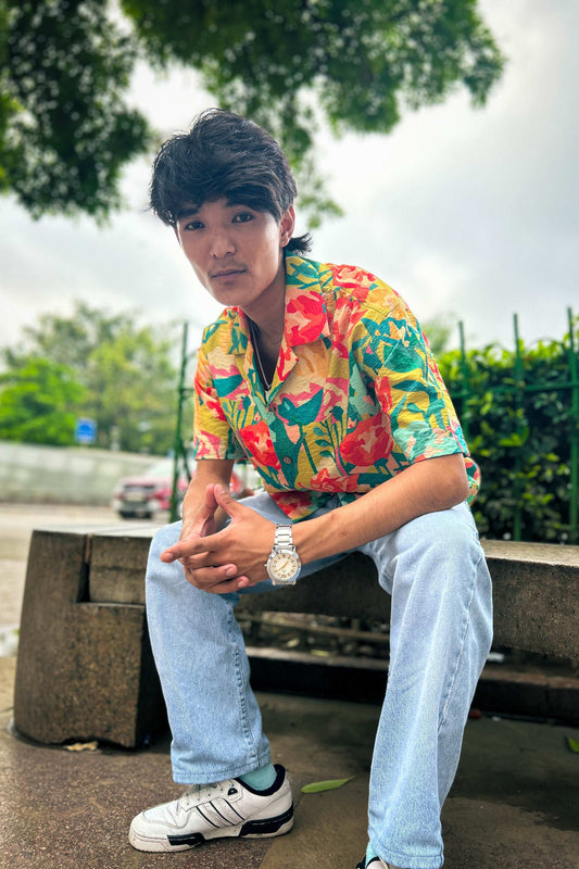 Green rose printed viscose shirt for men, seated view