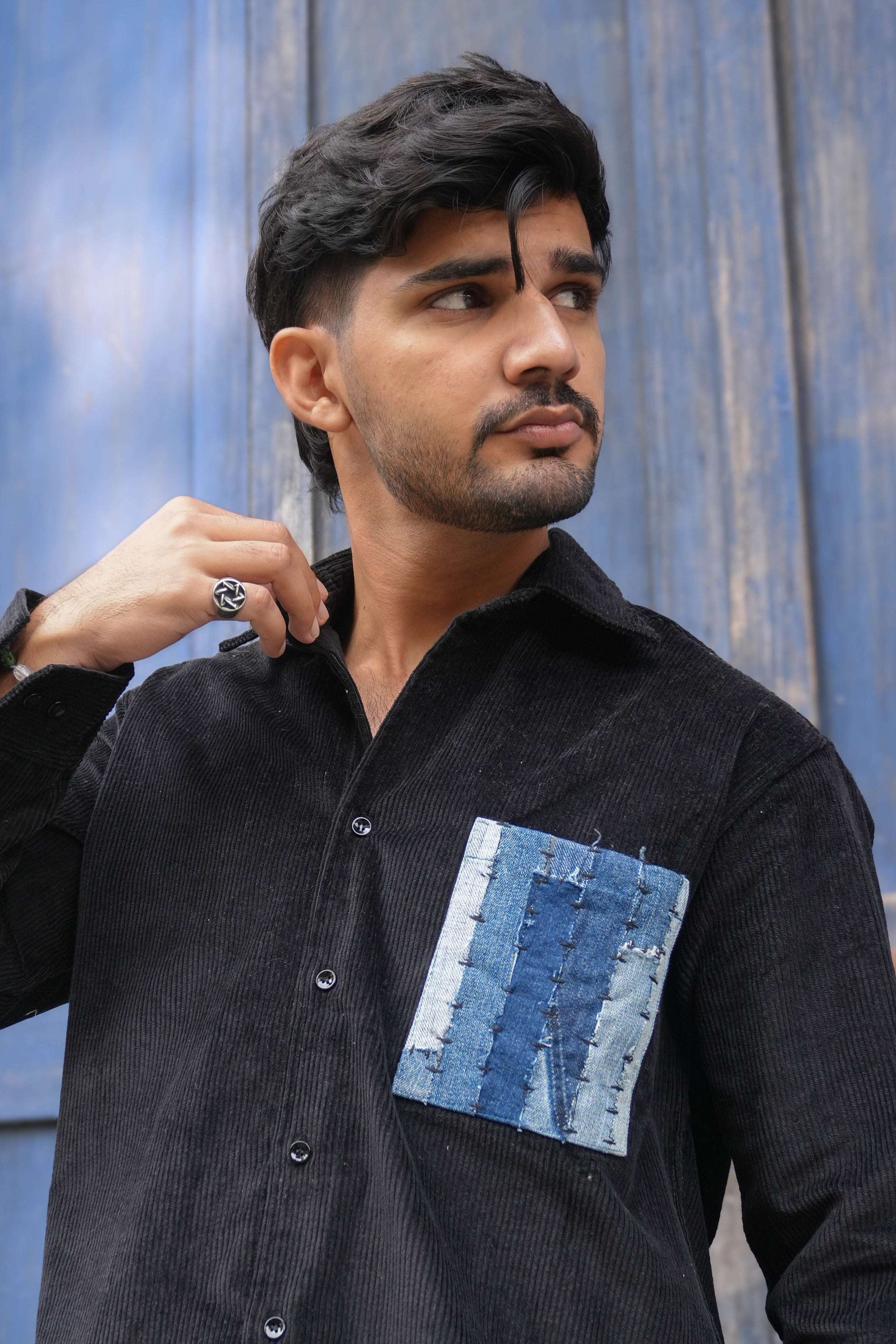Close-up of the denim patchwork pocket, Black corduroy men's shirt