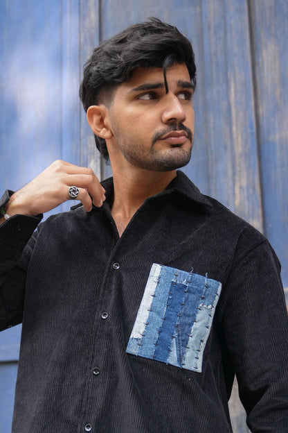 Close-up of the denim patchwork pocket, Black corduroy men's shirt