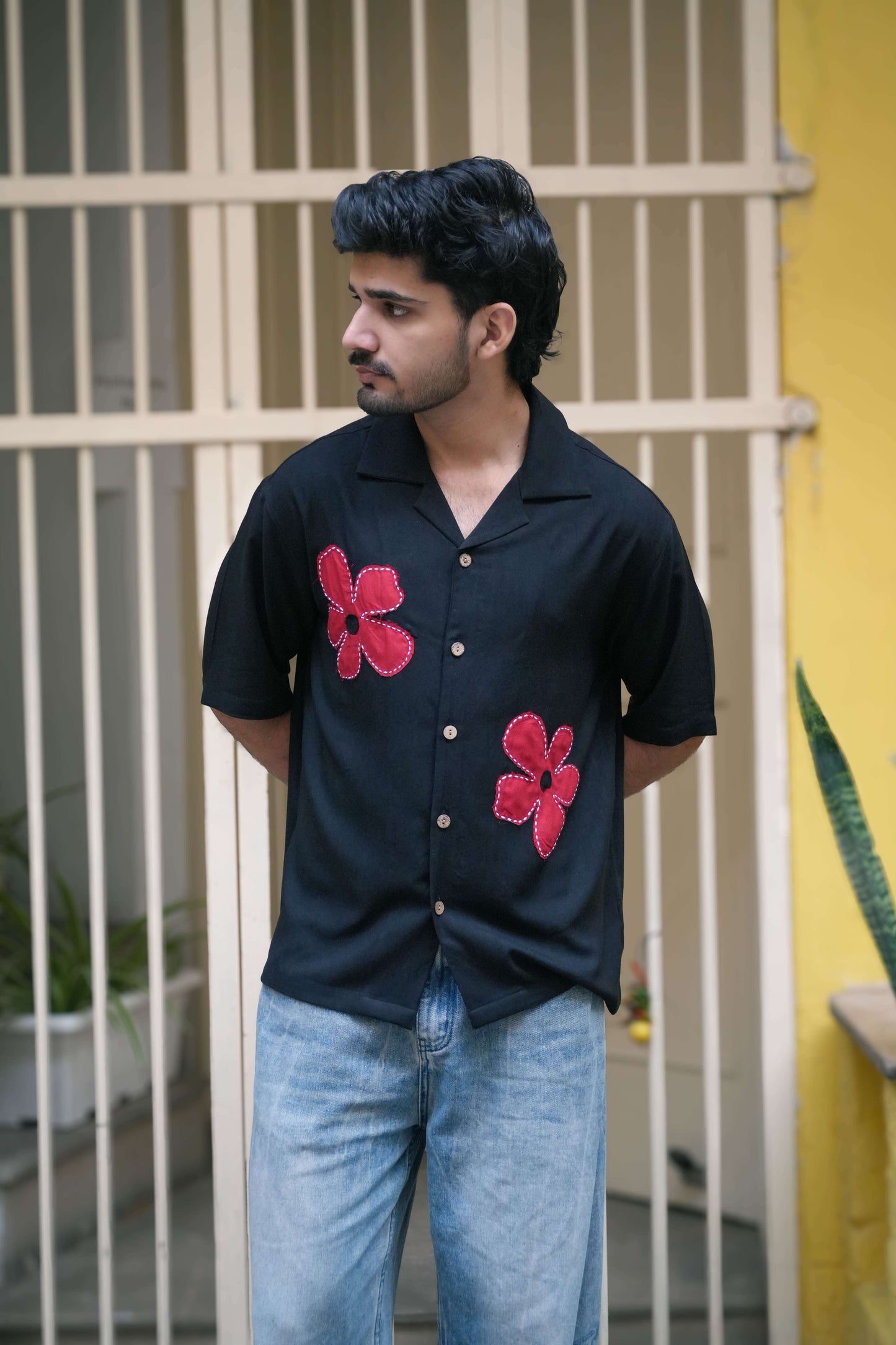 Black modal viscose shirt for men with hand appliquéd red floral motifs, front view