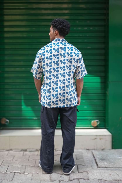 Back view of Indigo blue printed viscose men's shirt showing the relaxed drape