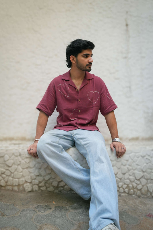 Mauve pink double cloth cotton shirt for men with kantha hand embroidered heart motifs, seated full view
