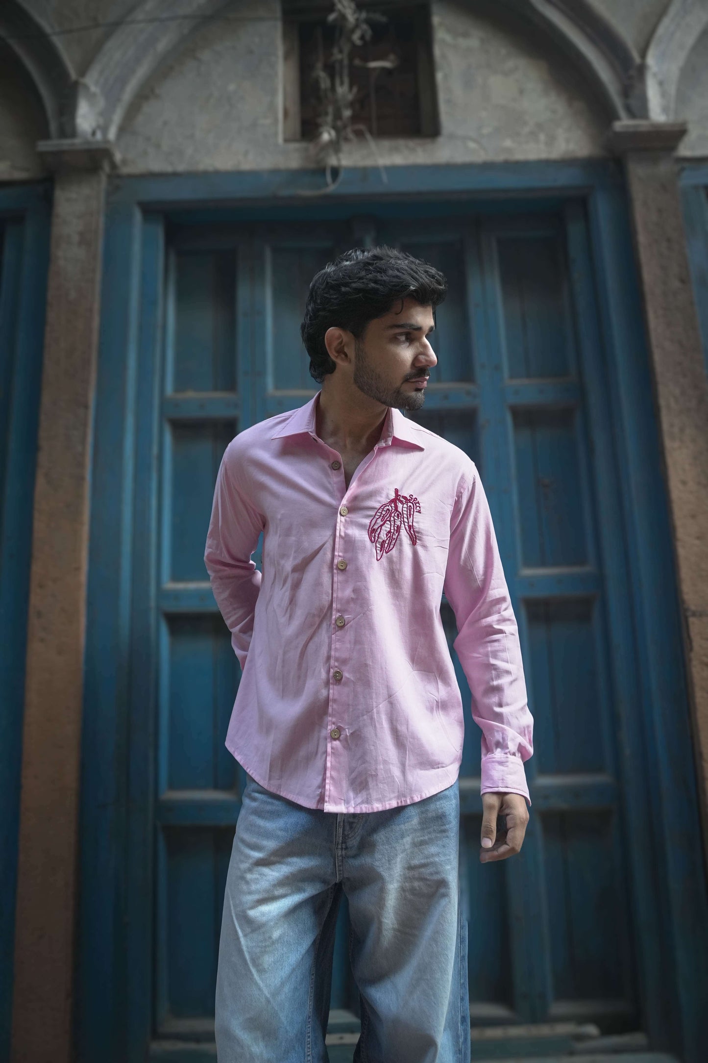 Blush pink cotton satin shirt for men with hand embroidered chilli motif, full-length front view