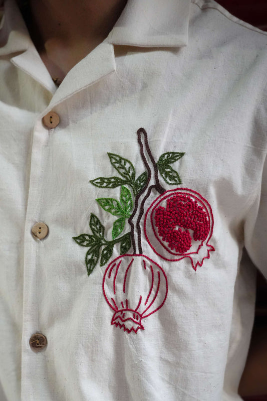 Close-up of the pomegranate embroidery in aari and French knots, Ivory handloom cotton men's shirt
