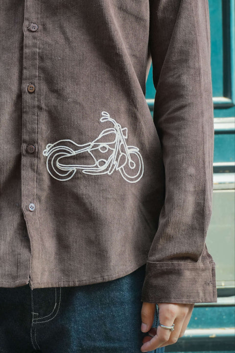 Close-up of the motorcycle embroidery on the hem, Brown corduroy men's shirt