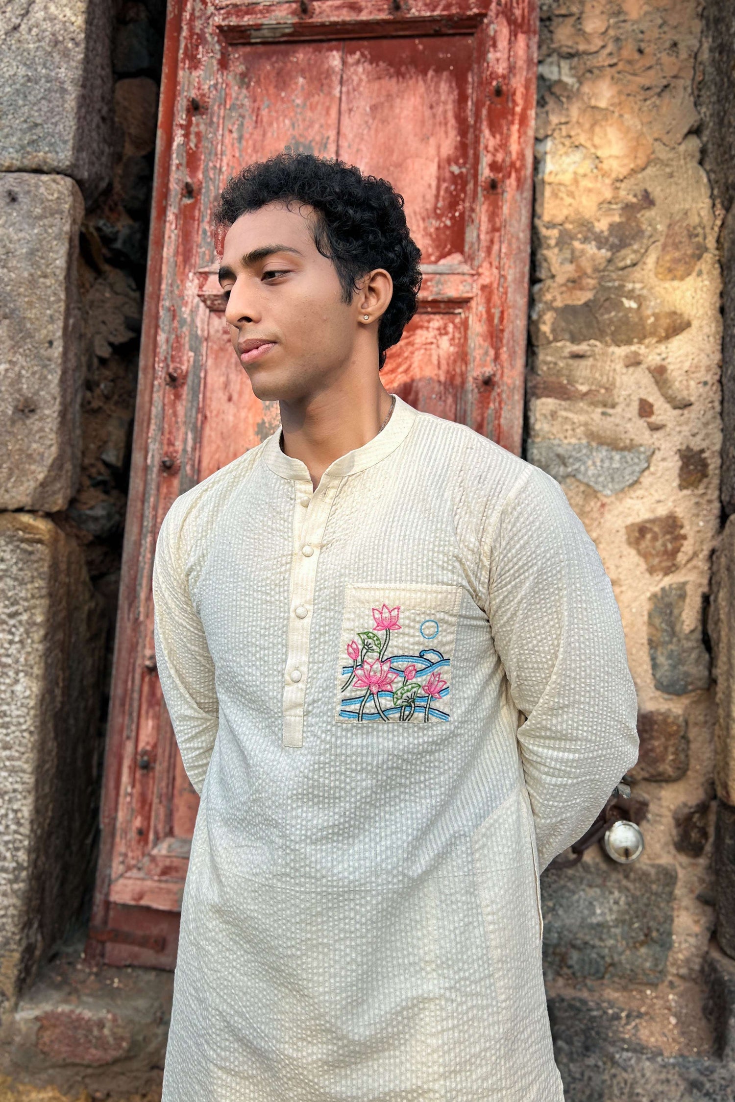 Ivory cotton kurta for men with hand embroidered lotus pond pocket, three-quarter view, Kashmir Embroidered Kurta by Oje'