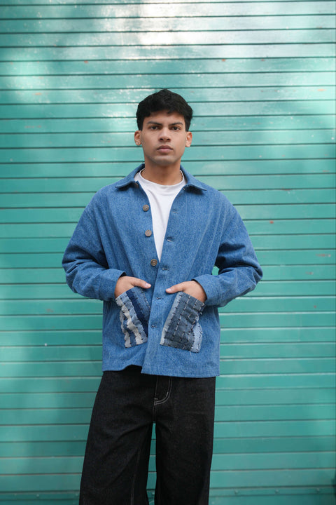 Blue denim jacket for men with patchwork pockets, front view
