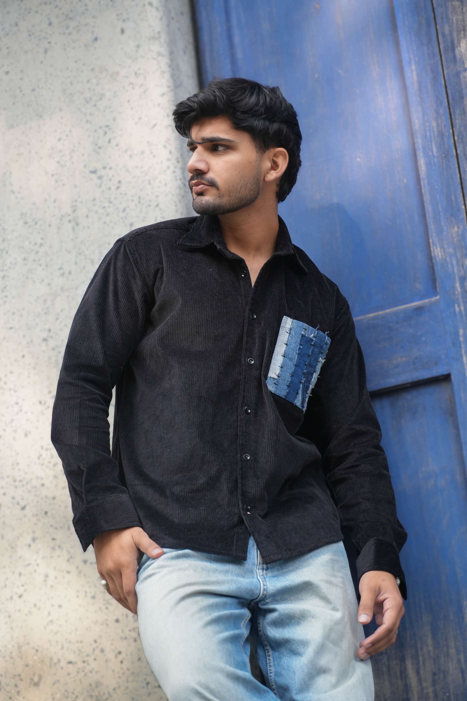 Black corduroy shirt for men with denim patchwork pocket, three-quarter view