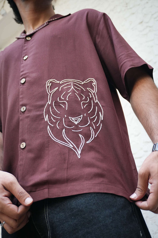 Close-up of the tiger motif embroidery on the hem, Brown modal viscose men's shirt