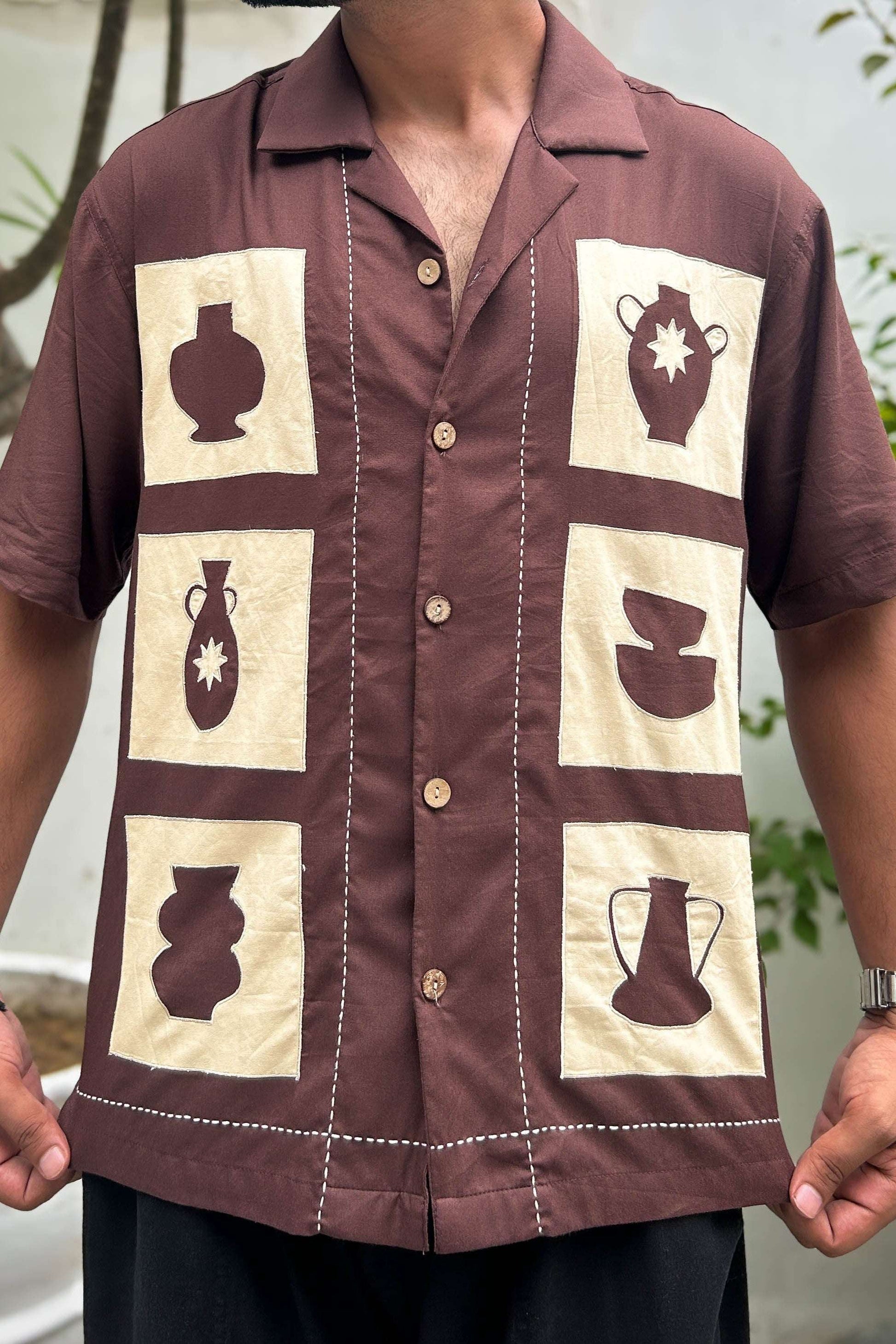 Close-up of the pottery appliqué panels with kantha detailing, Brown modal men's shirt