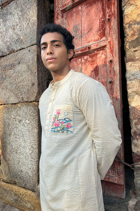 Ivory cotton kurta for men with hand embroidered lotus pond pocket, three-quarter view