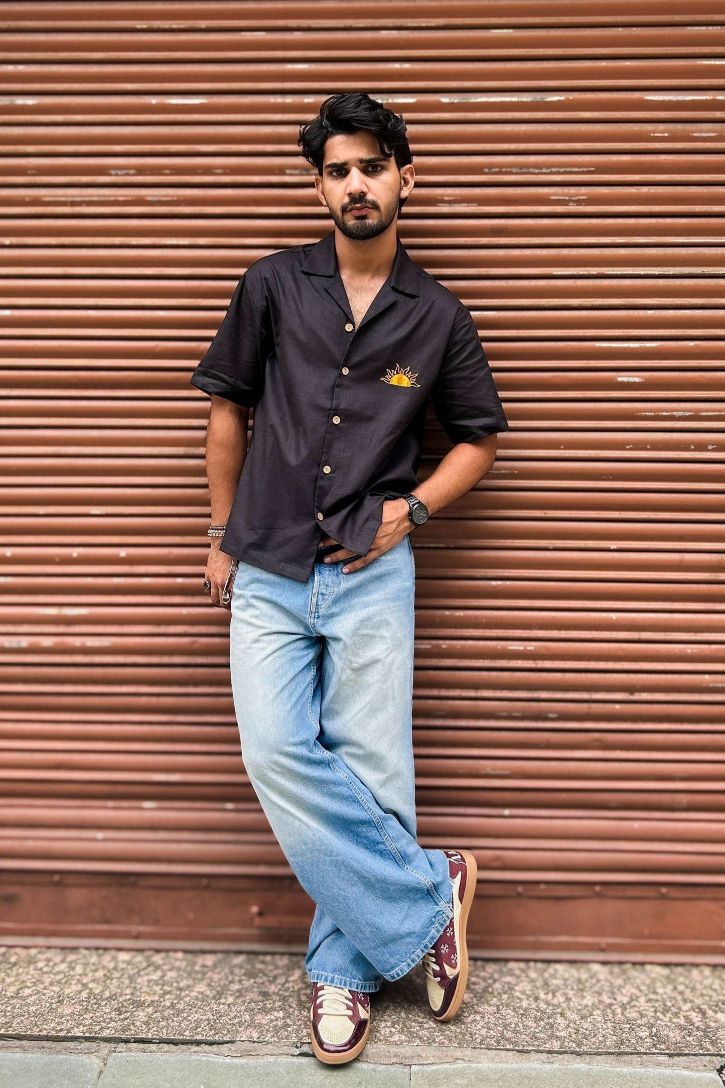 Black cotton shirt for men with appliquéd sun motif on the back, full-length view