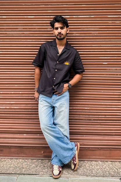 Black cotton shirt for men with appliquéd sun motif on the back, full-length view