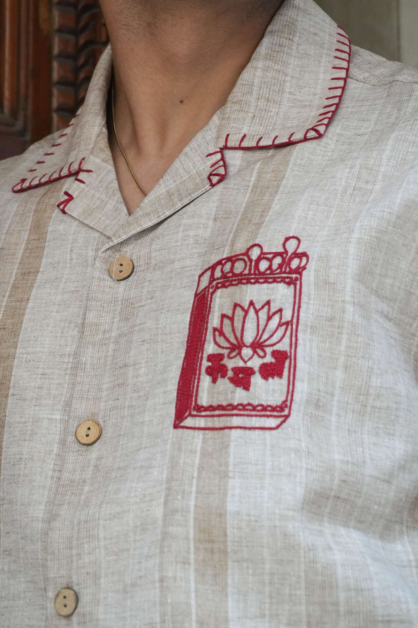 Close-up of the matchbox motif and blanket stitch collar, Sand beige cotton men's shirt