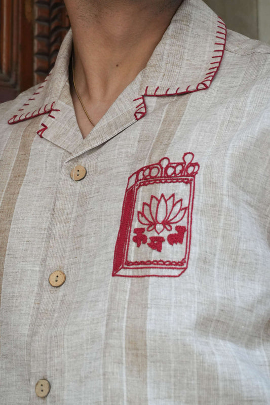 Close-up of the matchbox motif and blanket stitch collar, Sand beige cotton men's shirt