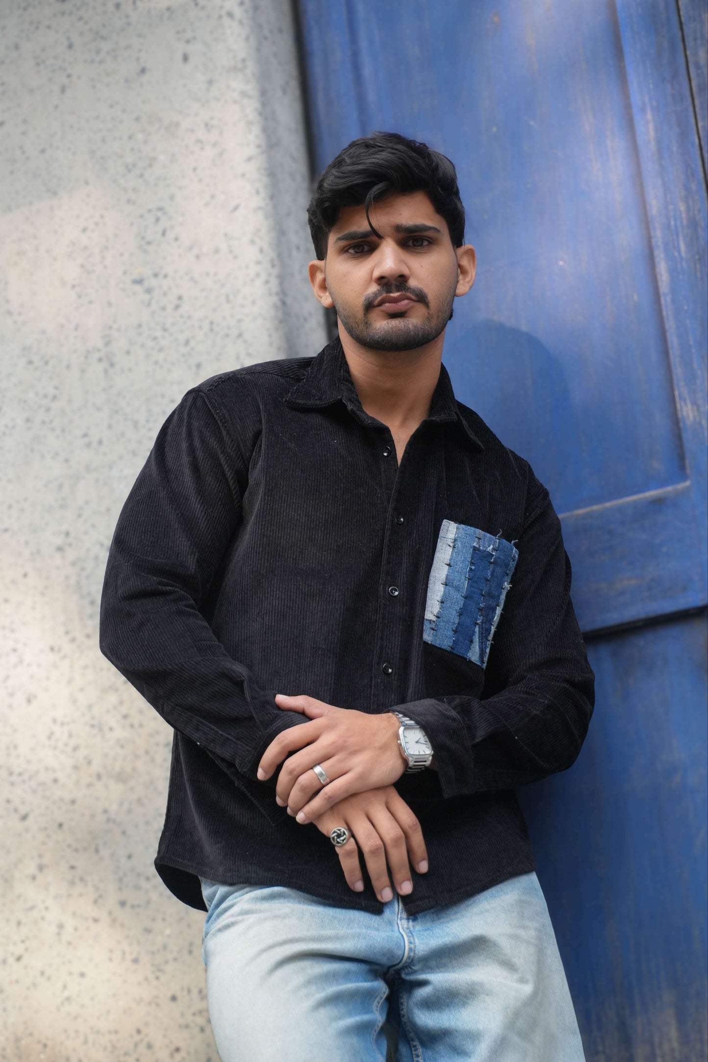 Black corduroy shirt for men with denim patchwork pocket, three-quarter view