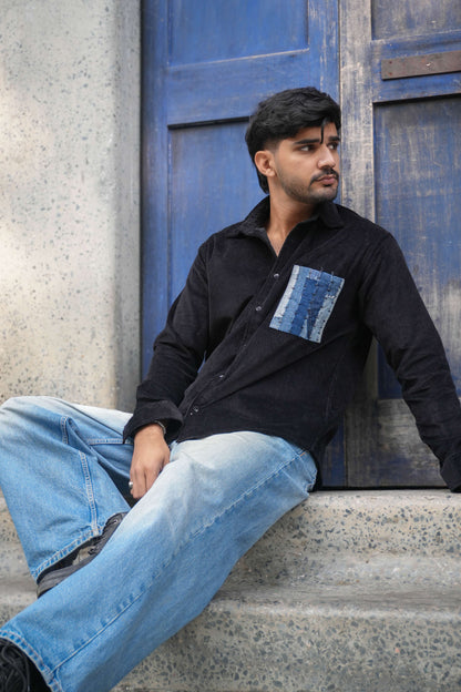 Black corduroy shirt for men with denim patchwork pocket, seated view