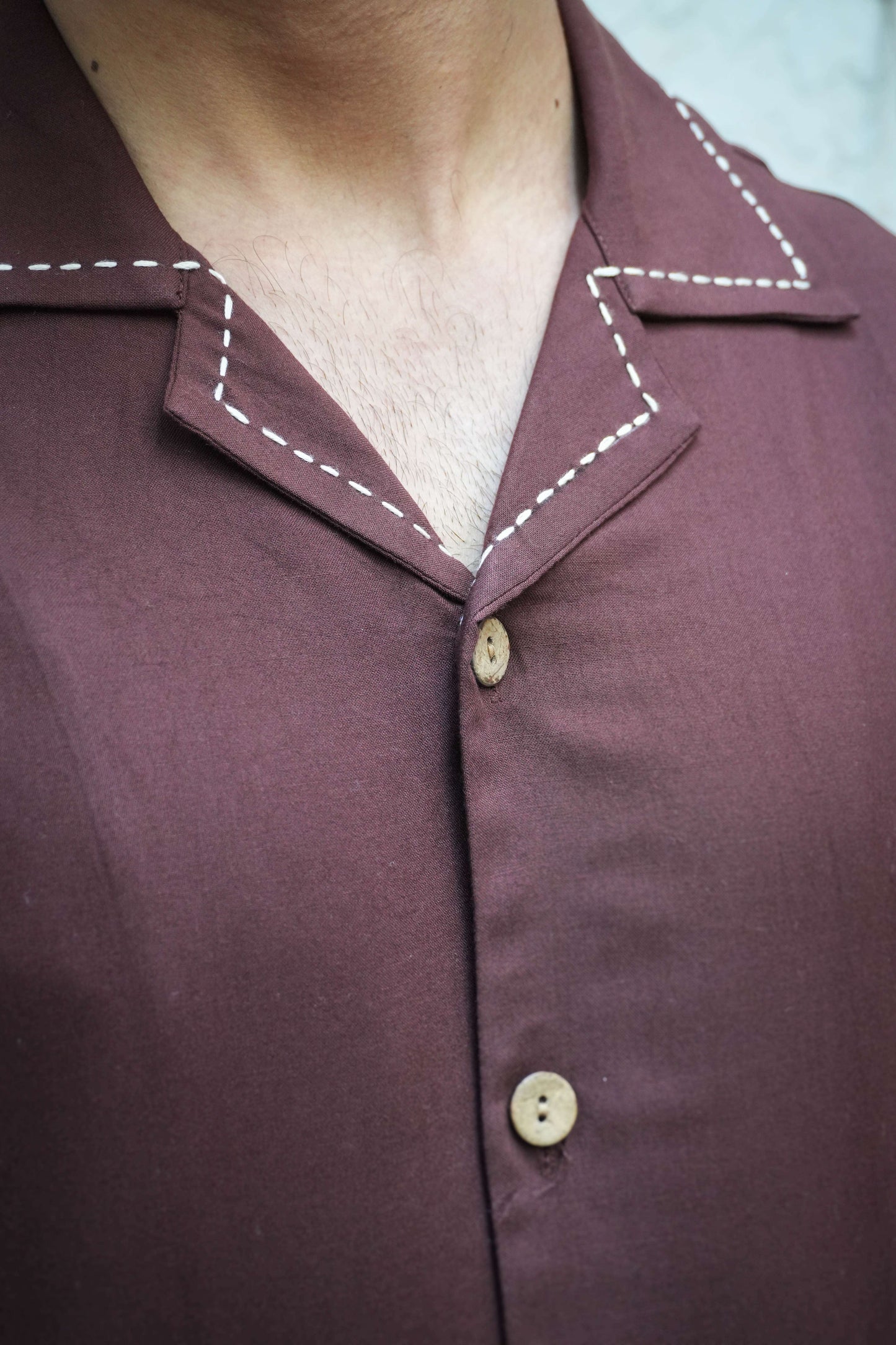 Close-up of Cuban collar with kantha stitch detail, brown modal viscose men's shirt