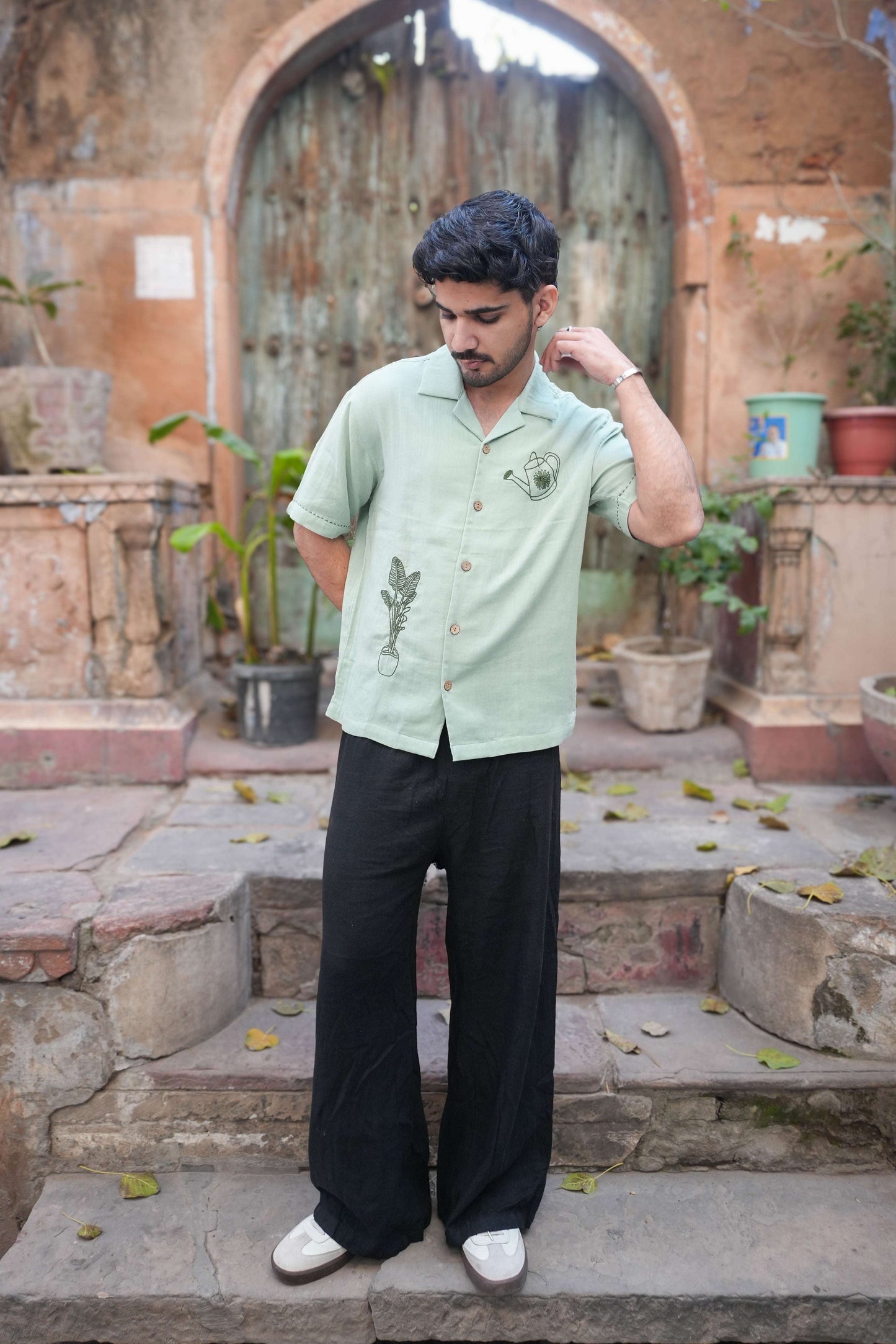 Sage green double cloth cotton shirt for men with aari hand embroidered garden motifs, full-length view
