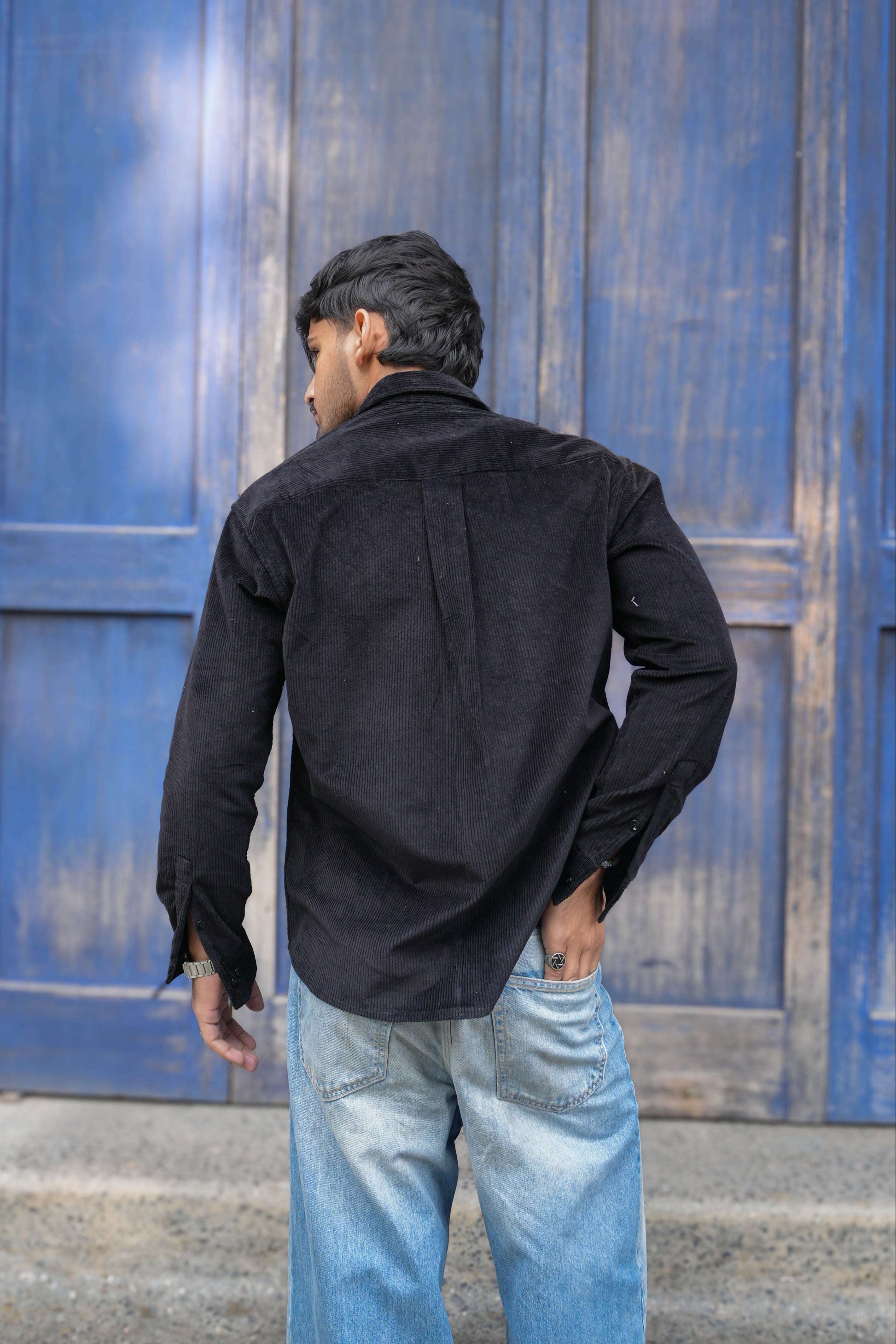 Back view of Black corduroy men's shirt showing the relaxed drape