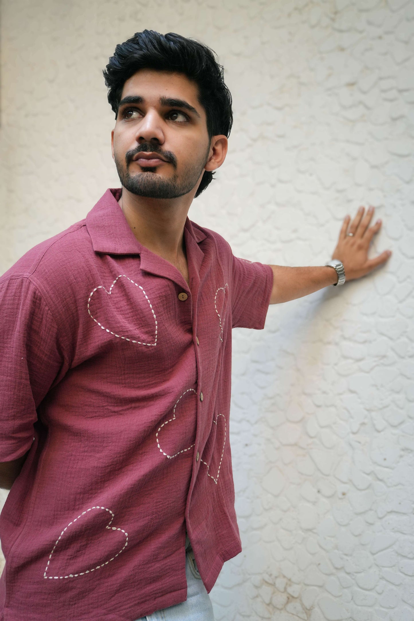 Mauve pink double cloth cotton shirt for men with kantha hand embroidered heart motifs, three-quarter view