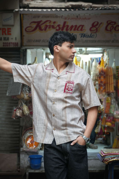 Sand beige cotton shirt for men with hand embroidered matchbox motif, three-quarter view, Sivakasi Embroidered Shirt by Oje'