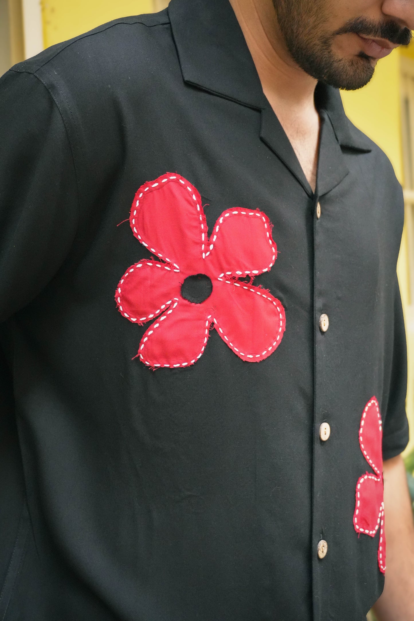 Close-up of the red floral appliqué on the chest, Black modal viscose men's shirt