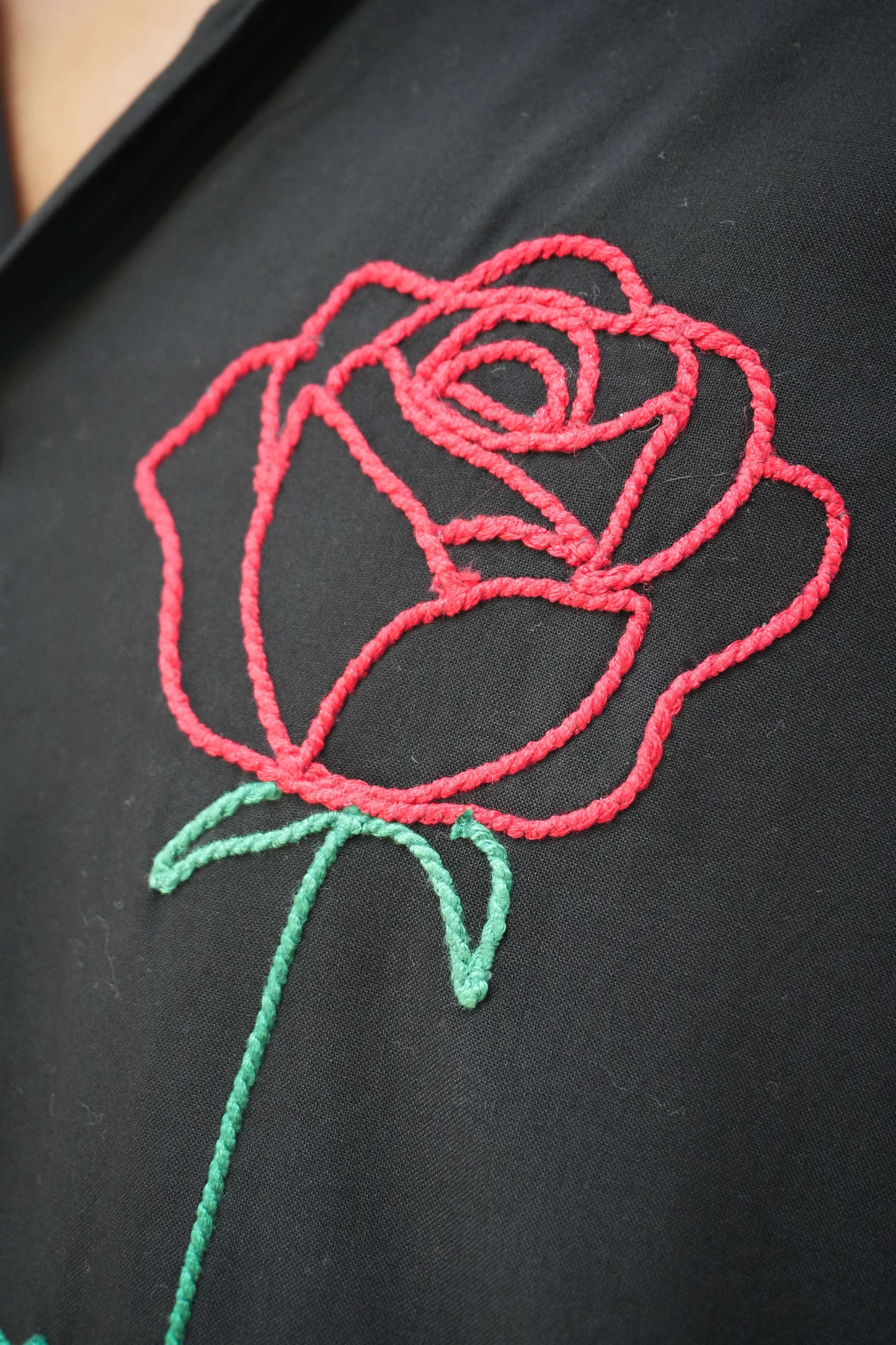 Close-up of the red rose embroidery, Black modal viscose men's shirt