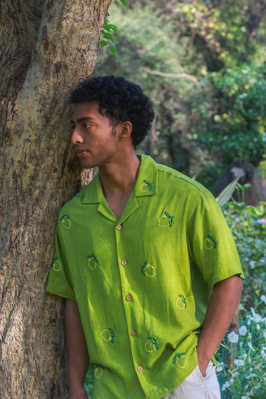 Apple green linen shirt for men with kantha lemon motifs, three-quarter view
