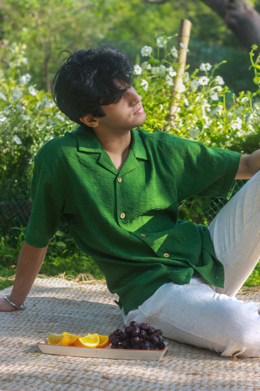 Forest green cotton shirt for men with golden woven stripes, seated view