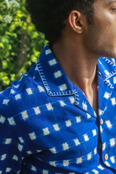 Close-up of the blanket stitch Cuban collar and ikat weave, royal blue ikat handloom cotton men's shirt