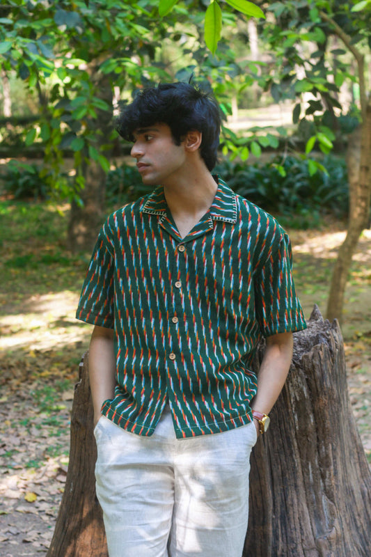 Green ikat handloom cotton shirt for men with hand embroidered collar detail, three-quarter view