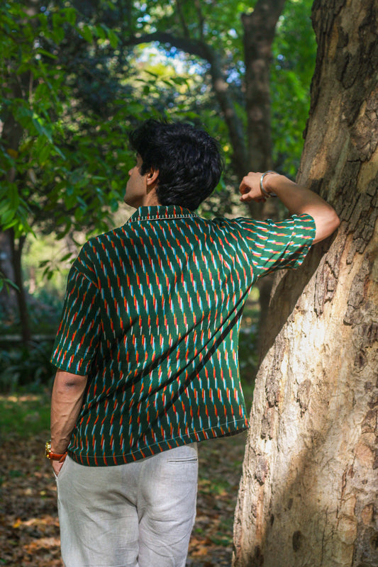 Green ikat handloom cotton shirt for men with hand embroidered collar detail, back three-quarter view