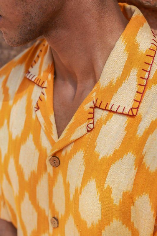 Close-up of the blanket stitch collar and ikat weave, Marigold yellow ikat handloom cotton men's shirt