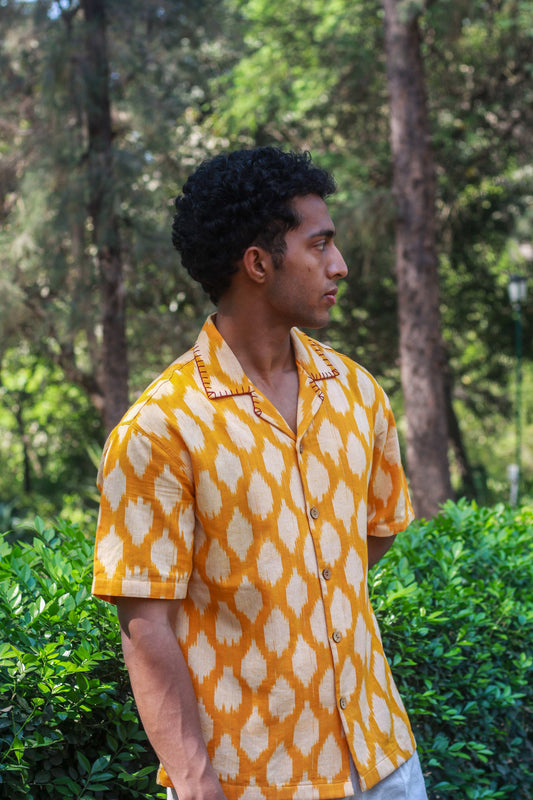 Marigold yellow ikat handloom cotton shirt for men with hand embroidered collar detail, side view