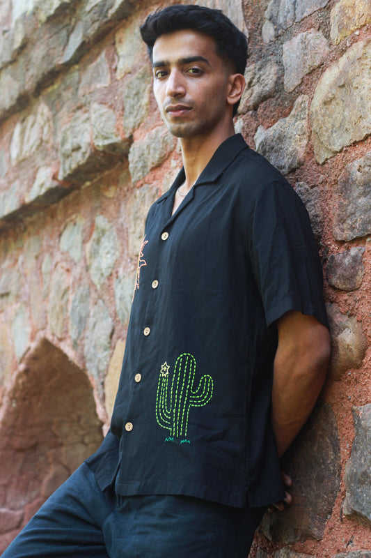 Black modal shirt for men with kantha sun and cactus motifs, three-quarter view