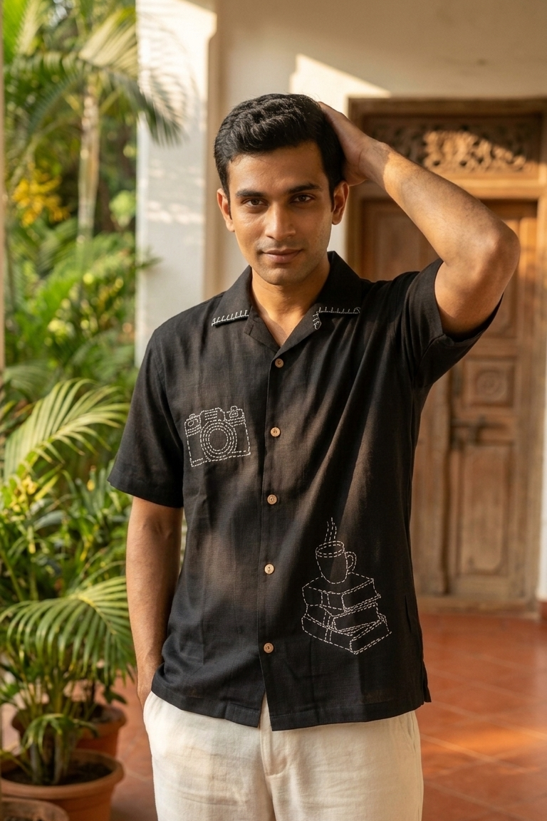 Man wearing black hand embroidered modal shirt outdoors, front view